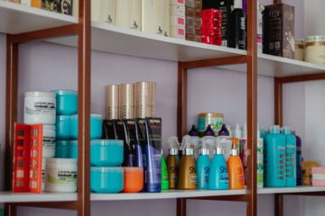 a shelf filled with lots of different types of hair products